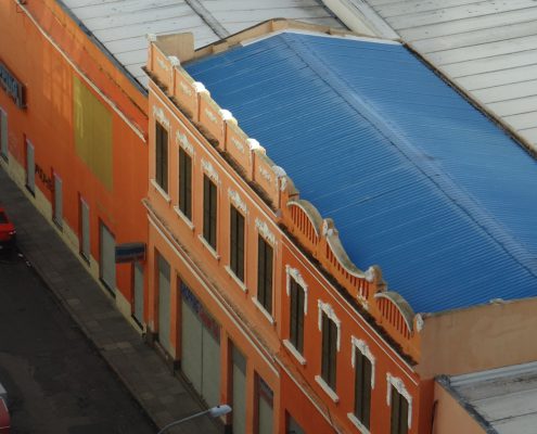 well maintained commercial roof protecting a business building exterior - how a well maintained roof protects your business