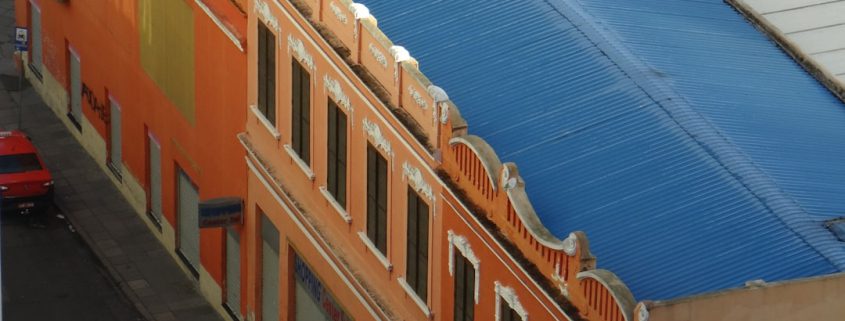 well maintained commercial roof protecting a business building exterior - how a well maintained roof protects your business