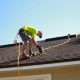 roof inspection professional examining shingles on residential home - how regular inspections prevent costly repairs