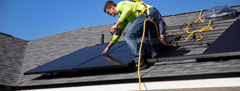 roof inspector examining shingles on residential home in Oregon - how regular inspections catch problems early