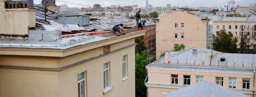 A professional roofing crew working on a home in the Portland metro area