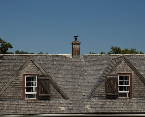 flat roof vs pitched roof comparison on a modern home - flat roof vs pitched roof comparison