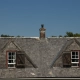 flat roof vs pitched roof comparison on a modern home - flat roof vs pitched roof comparison
