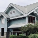 asphalt shingle vs metal roof comparison on a modern home