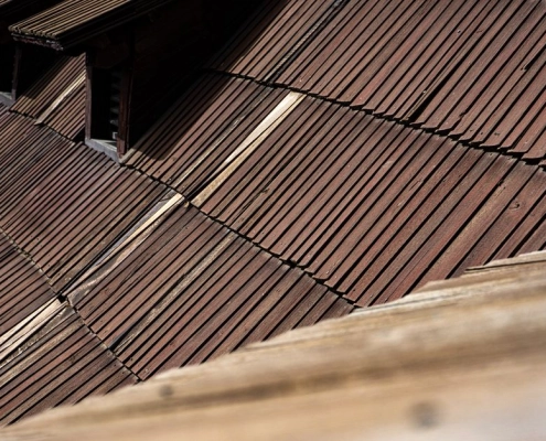 roofing material samples displayed on a roof surface showing different textures and colors