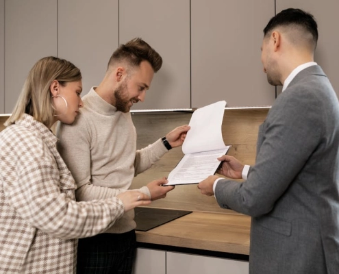 homeowner reviewing warranty document with independent contractor
