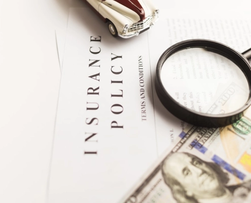 homeowner reviewing roofing contractor license and insurance documents at kitchen table