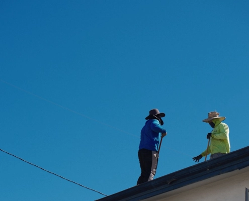 certified roofing contractor inspecting a residential roof in Beaverton Oregon