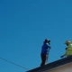 certified roofing contractor inspecting a residential roof in Beaverton Oregon
